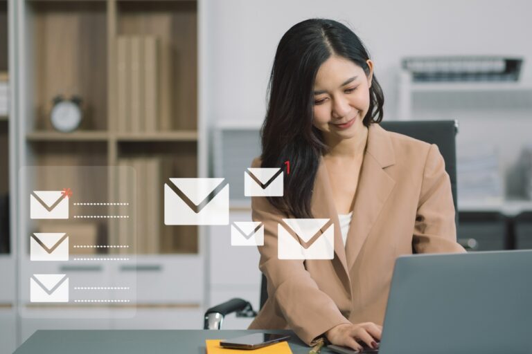 This concept showing female using smartphone and laptop receiving email notifications