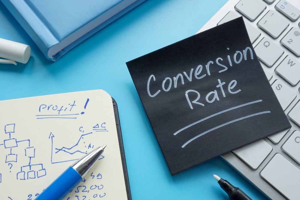 Conversion rate memo written on black paper for marketing analytics and performance tracking
