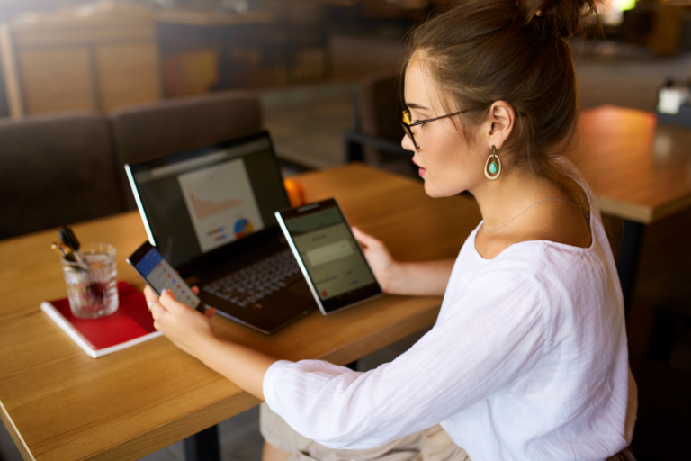 Woman using tablet managing patient recall system for dental appointment reminders