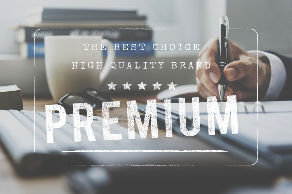 Businessman working on the table with premium stamp for branding and business approval concept
