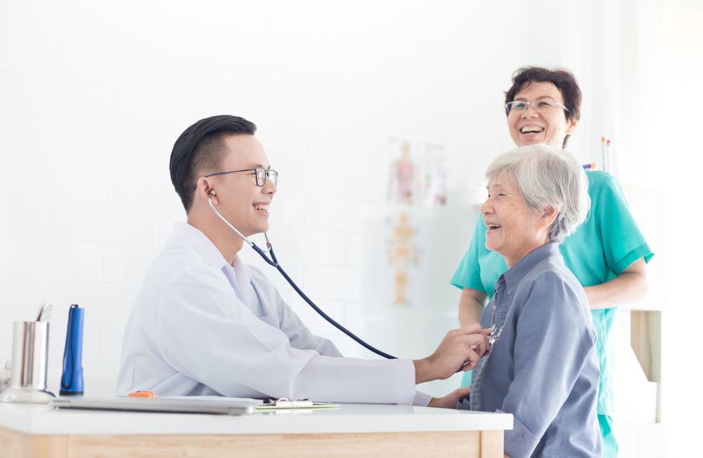 Grateful patient shaking dentist’s hand after a successful dental checkup and branding concept